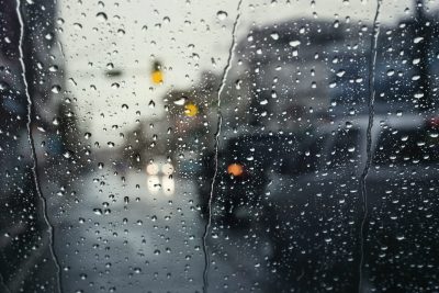 Morning traffic on rainy day,view through the windshield during rain storm with selective focus.