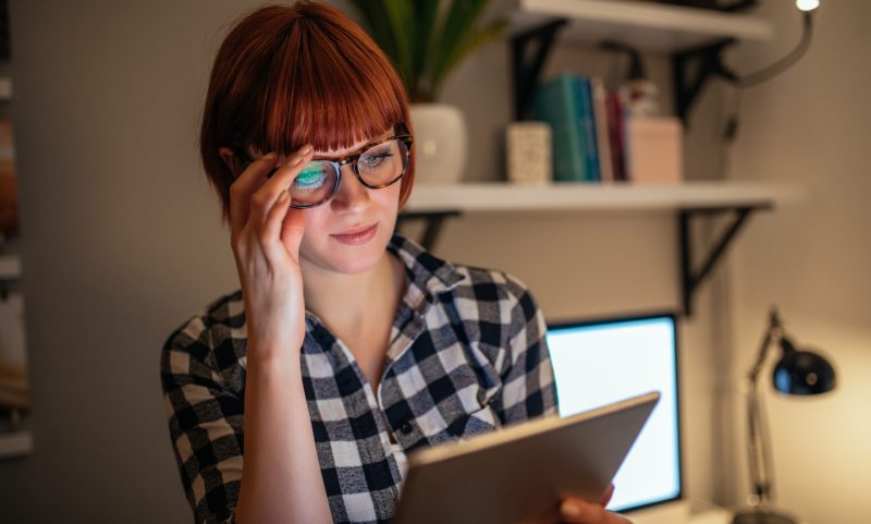 Young business woman using digital tablet.